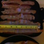 Bacon cooking with tape measure
