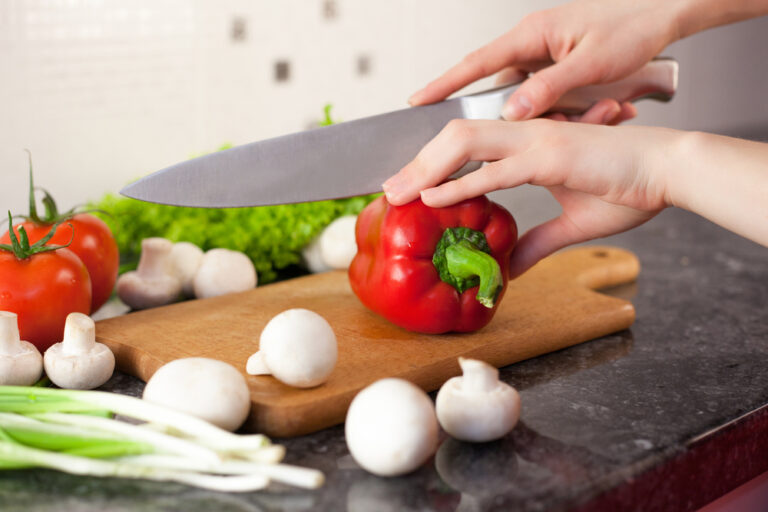 Chef's Knife cutting through bell pepper