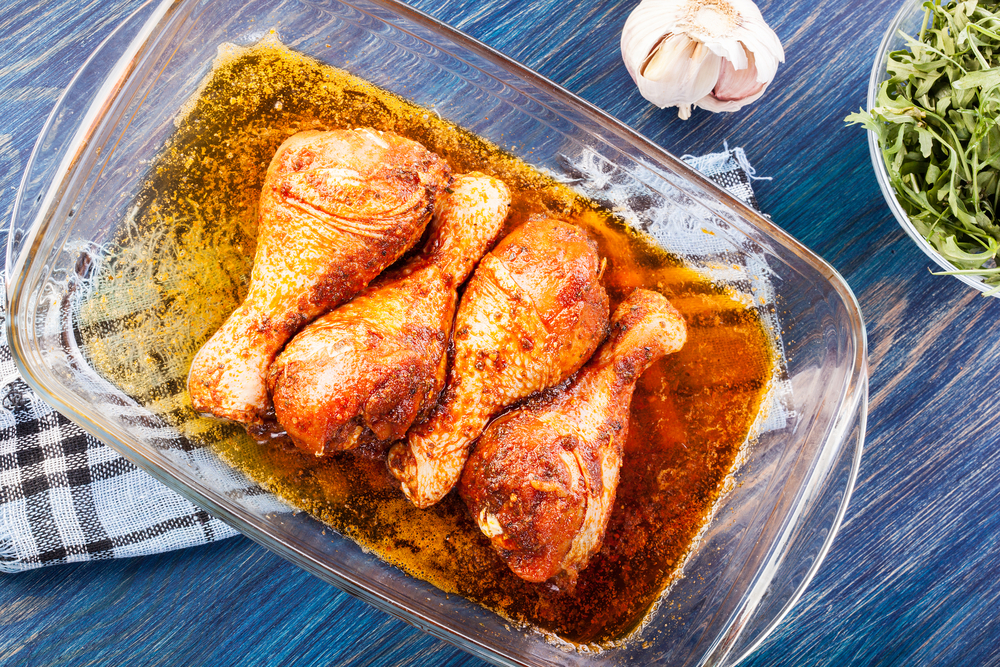 marinated chicken in pan at barbecue